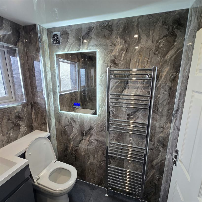 Heated towel rail and lit mirror