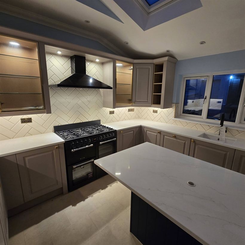 Shaker kitchen with island and glazed wall units